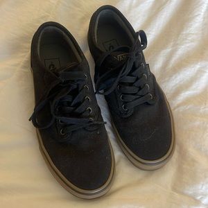 Size men’s 7 womens 8.5 black vans with gummy colored sole.